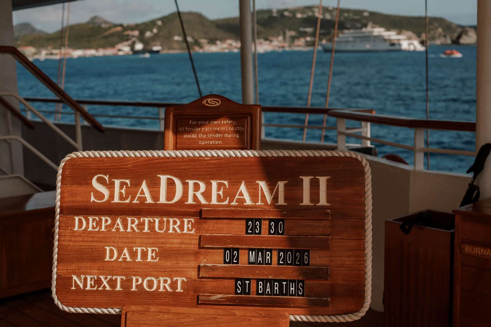 Welcome drinks on the open deck of a yacht at golden hour, Caribbean